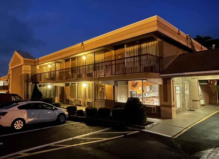 Travelers Inn exterior at night